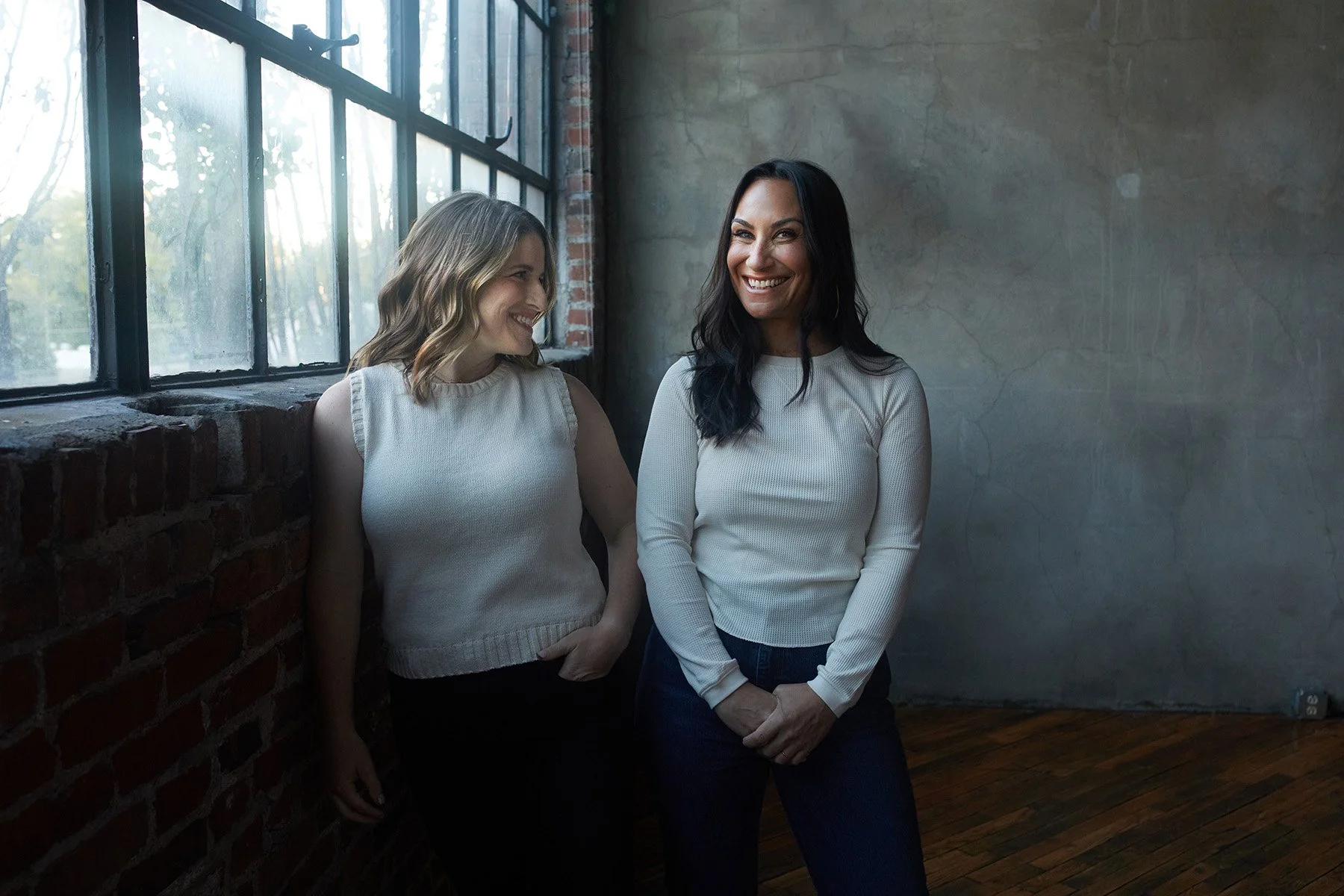 Jenna and Stacy by the studio window